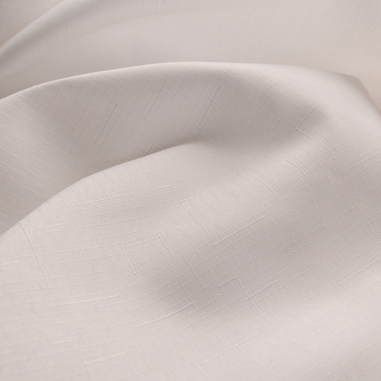 Close-up of beige fabric with a subtle texture