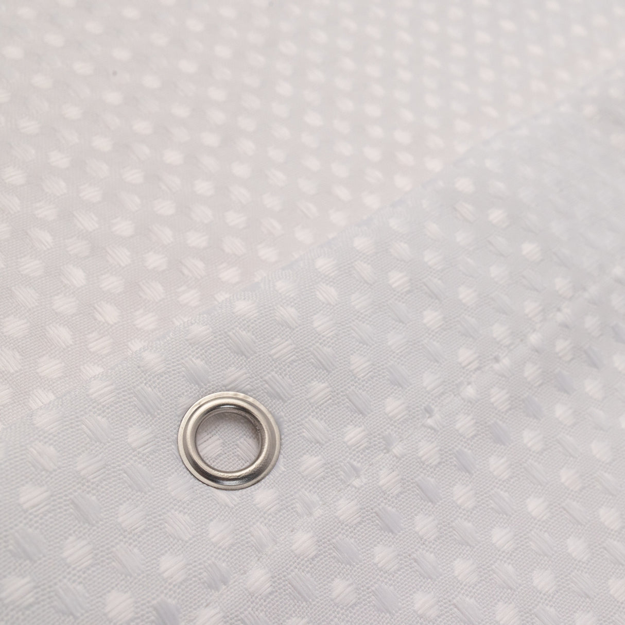 Metallic washer on a textured gray background