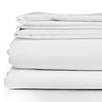 White bed sheet set neatly folded. Product shot.