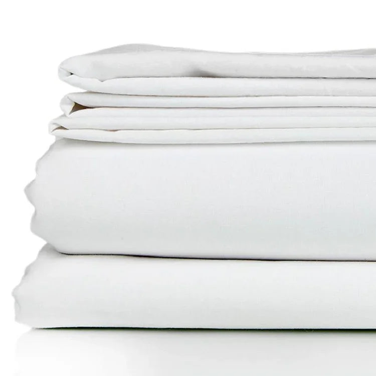 White bed sheet set neatly folded. Product shot.