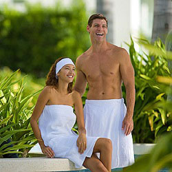 Spa Wrap worn by male and female models in green garden.
