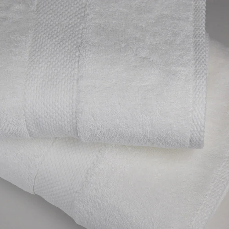 Product features a display of fluffy, high quality towels folded neatly on top of eachother.