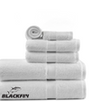 Set of white towels with Blackfin logo on a white background