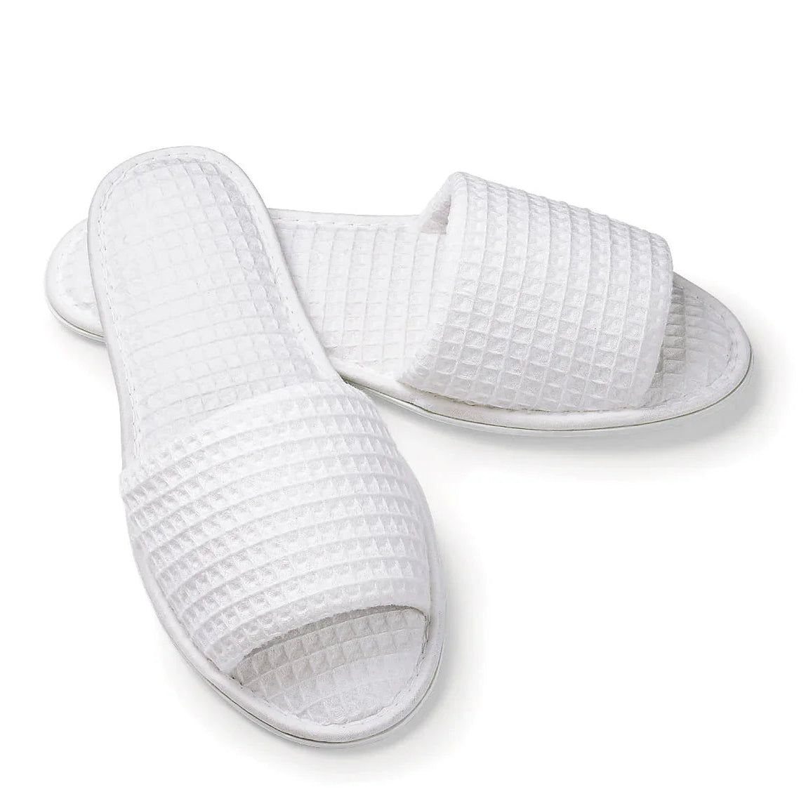 Pictured: White open toe waffle slippers against a white background.