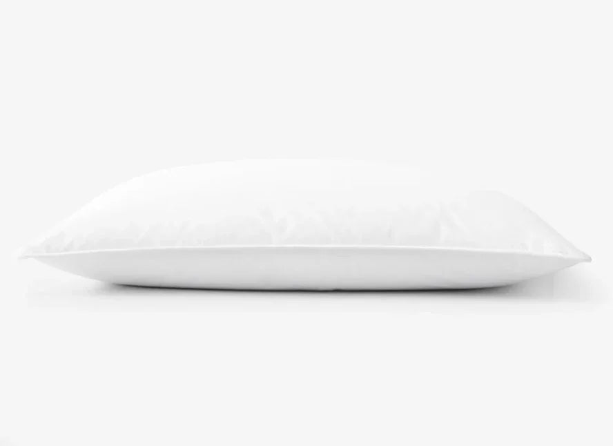 Product shot of white pillow by a wholesale supplier for hotels, healthcare and hospitality. Product shot, white background.