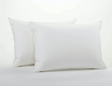Two white pillows with a knife edge finish on a white background.