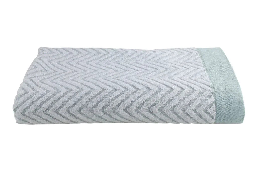 Product features high quality hotel towels with herringbone design in a light green and white color. Texture is soft and lightly brushed. White background.
