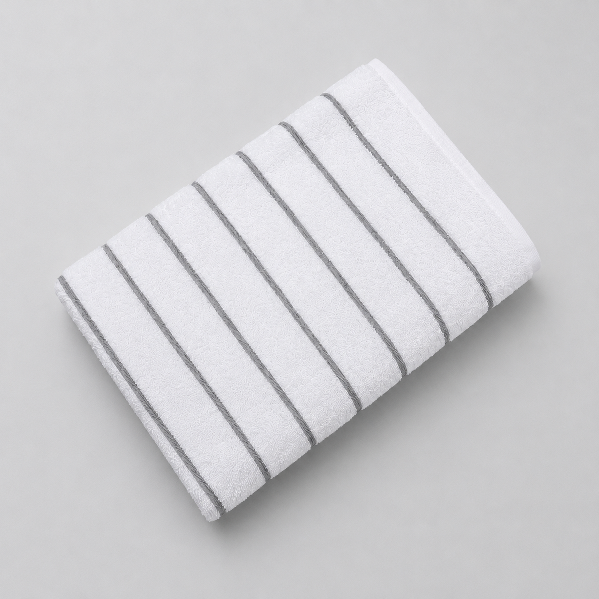 Pictured: Fibertone Twill Striped Pool Towel neatly folded against a white background. The stripes are colored and listed under the shade "Gray".
