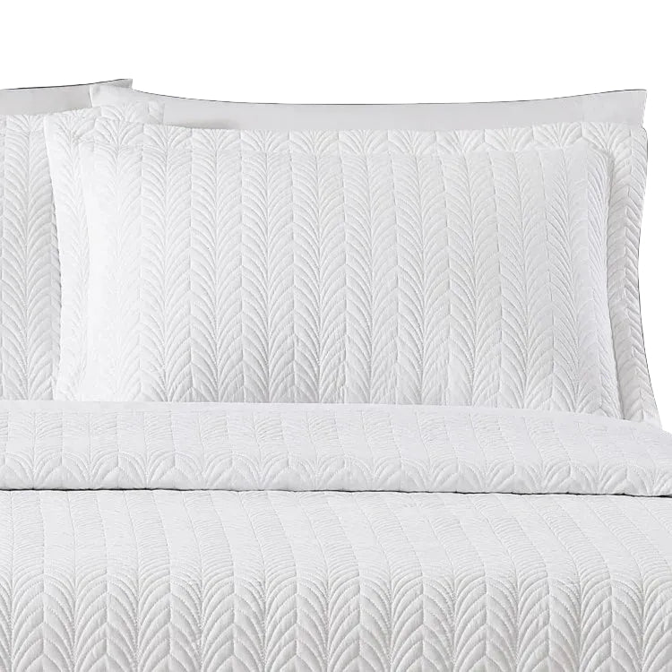 Pictured: Close-up of the Flourish Quilt Pillow Sham in the shade White.