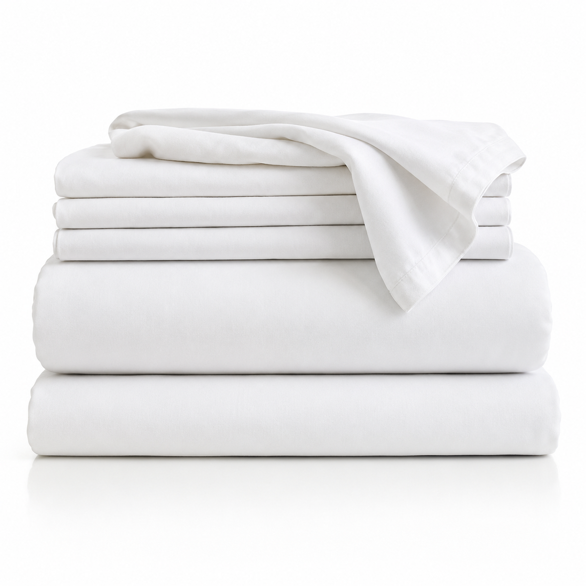 Folded stack of white bed sheets