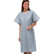 Model of patient wearing a patient gown, perfect for healthcare services. Sold in wholesale supply by Boston Textile Co.