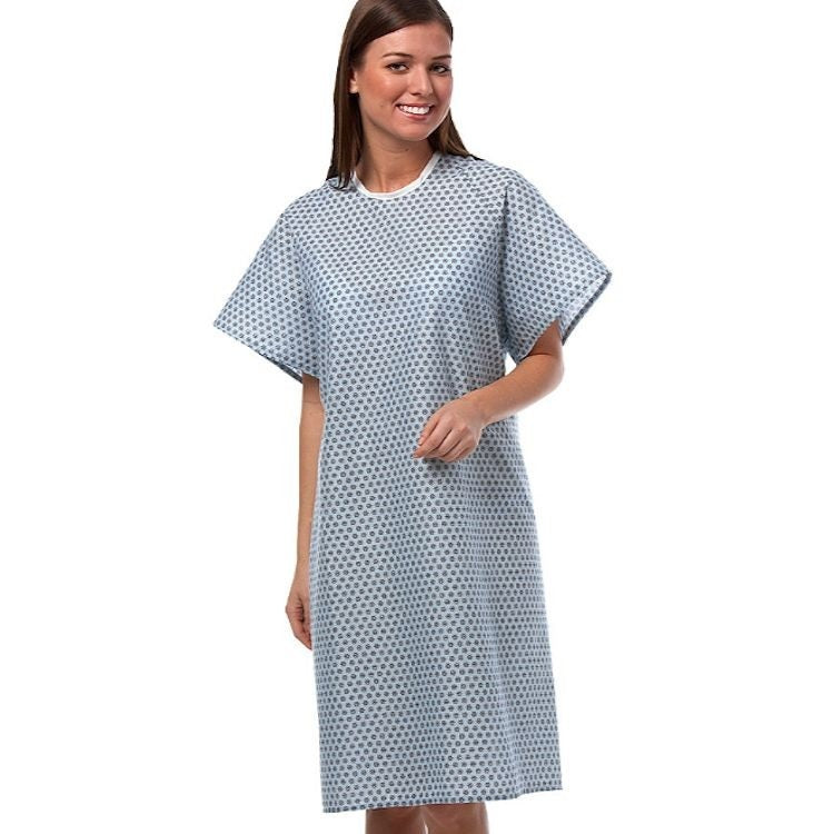 Model of patient wearing a patient gown, perfect for healthcare services. Sold in wholesale supply by Boston Textile Co.
