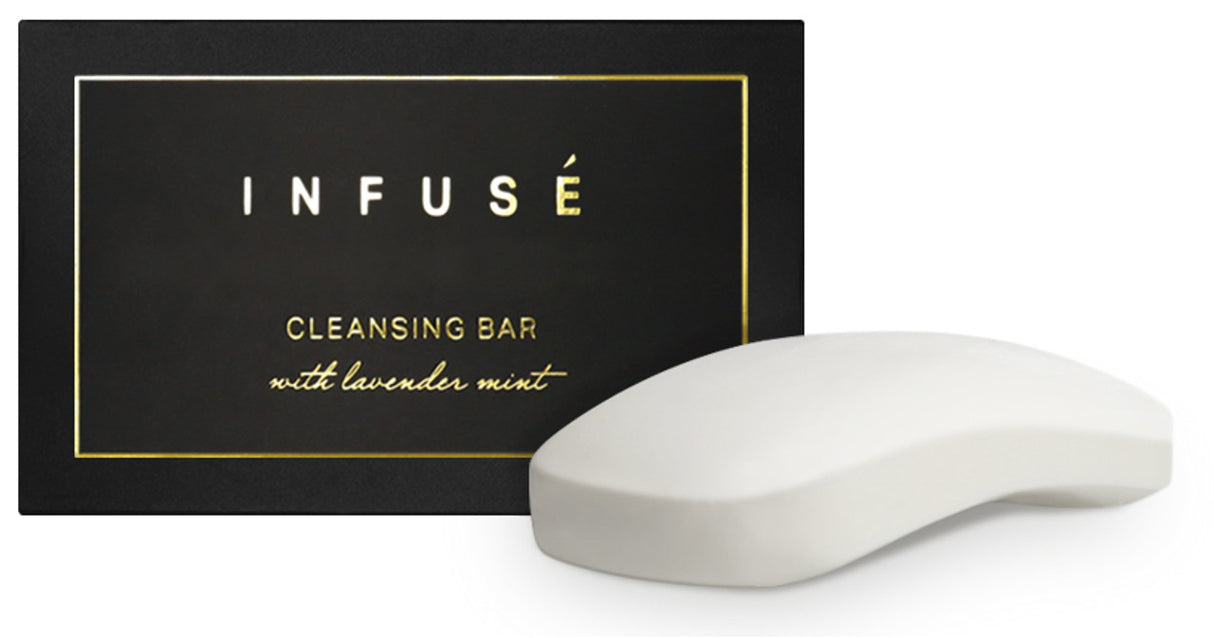 Product shot of large infuse cleansing bar in lavender mint scent. Product shown outside the box. Black and gold detail.