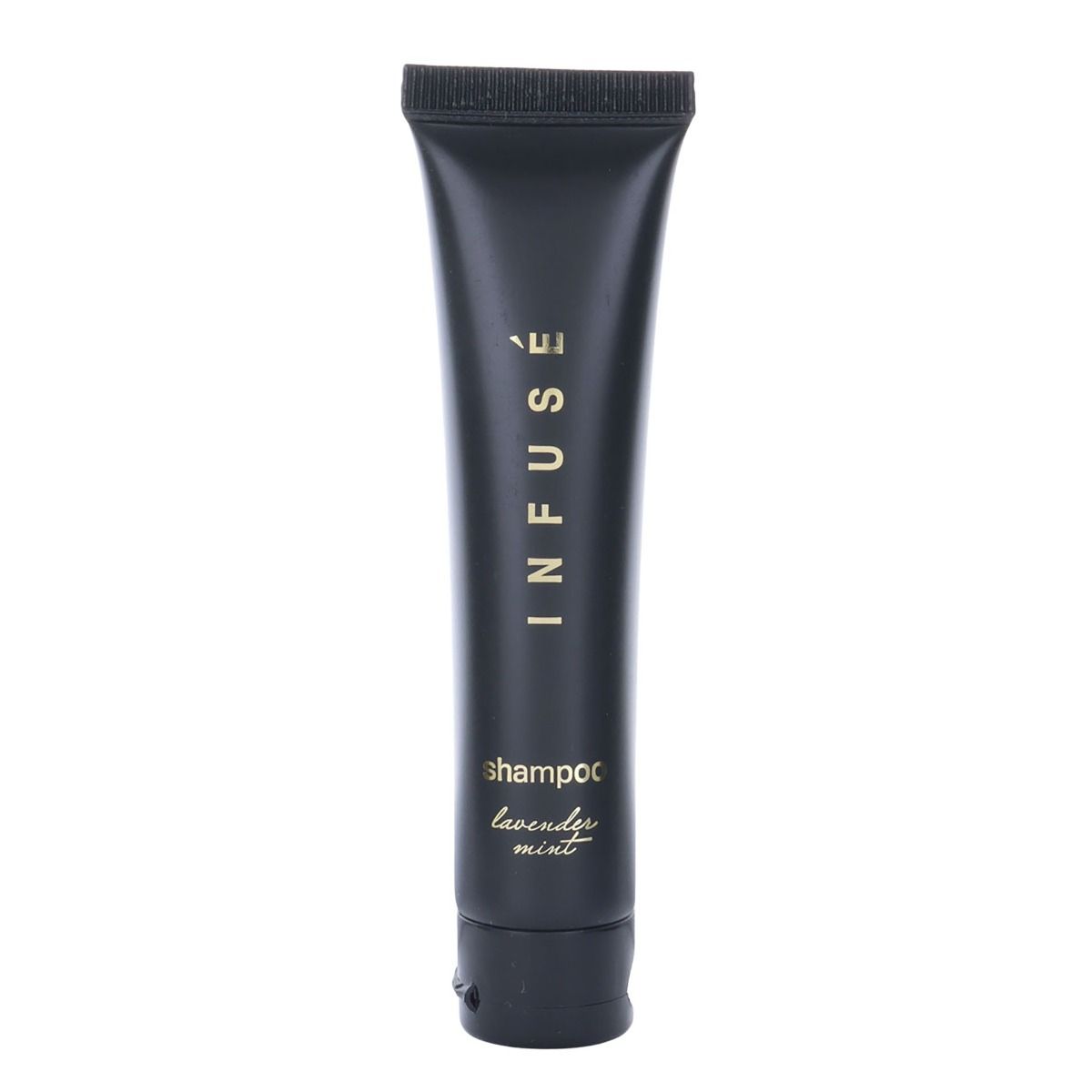 Shampoo with lavender mint scent by Infuse. Product shot of hotel amenities in a sample size. Black bottle with gold detailing.