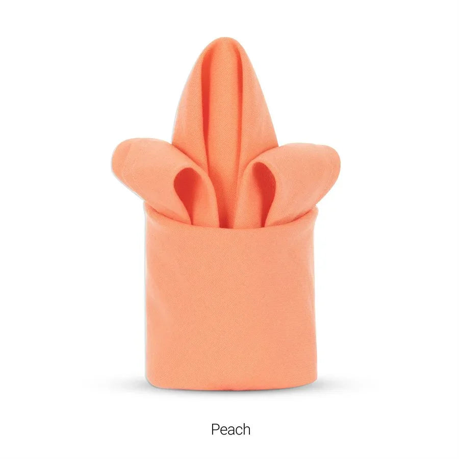 Peach colored polyester napkin for hotels and restaurants.