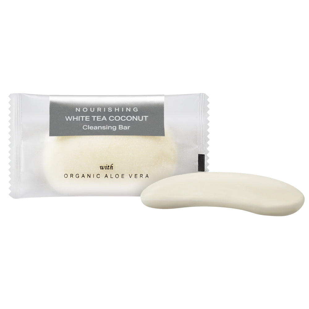 Product shot of hotel amenity cleansing bar with nourishing white tea coconut and organic aloe vera. Both inside and outside the packaging