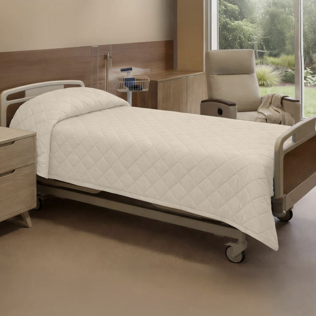 Hospital bed in a room with a chair and window view
