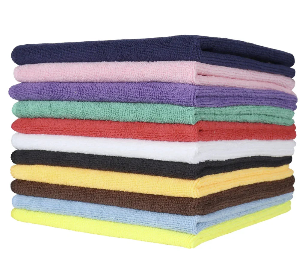 A stack of microfiber cleaning cloths in various solid colors including blue, green, red, yellow, and black.