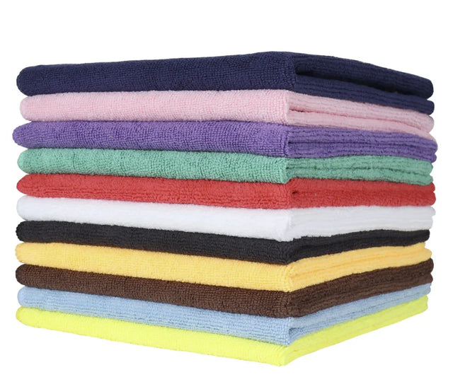 A stack of microfiber cleaning cloths in various solid colors including blue, green, red, yellow, and black.