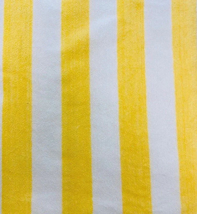 Product closeup of a cabana pool towel. Product is soft cotton with white and yellow striped details. Product is sold in wholesale supply for hotels and hospitality.