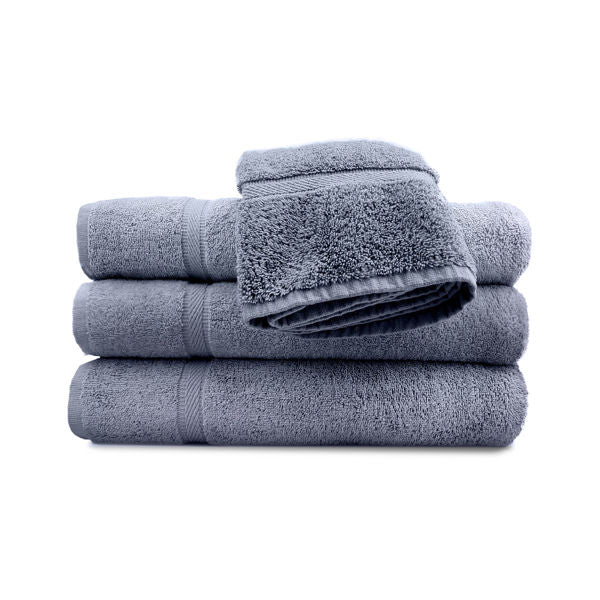 A set of blue pool towels stacked neatly, with a classic dobby border.