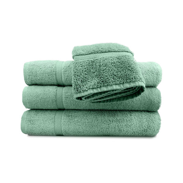 A set of green pool towels stacked neatly, with a classic dobby border.