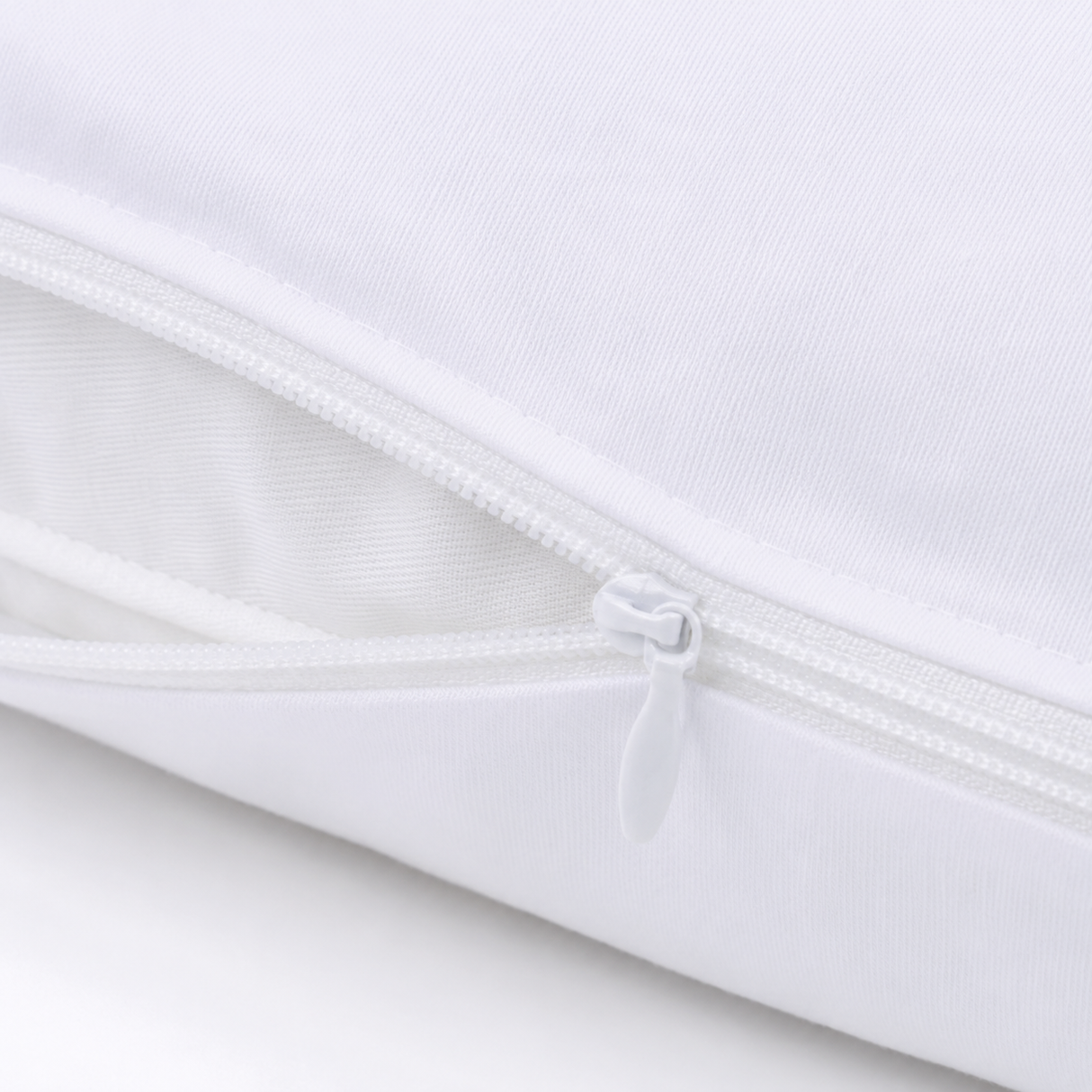 Close-up of a white fabric with a zipper on a light gray background