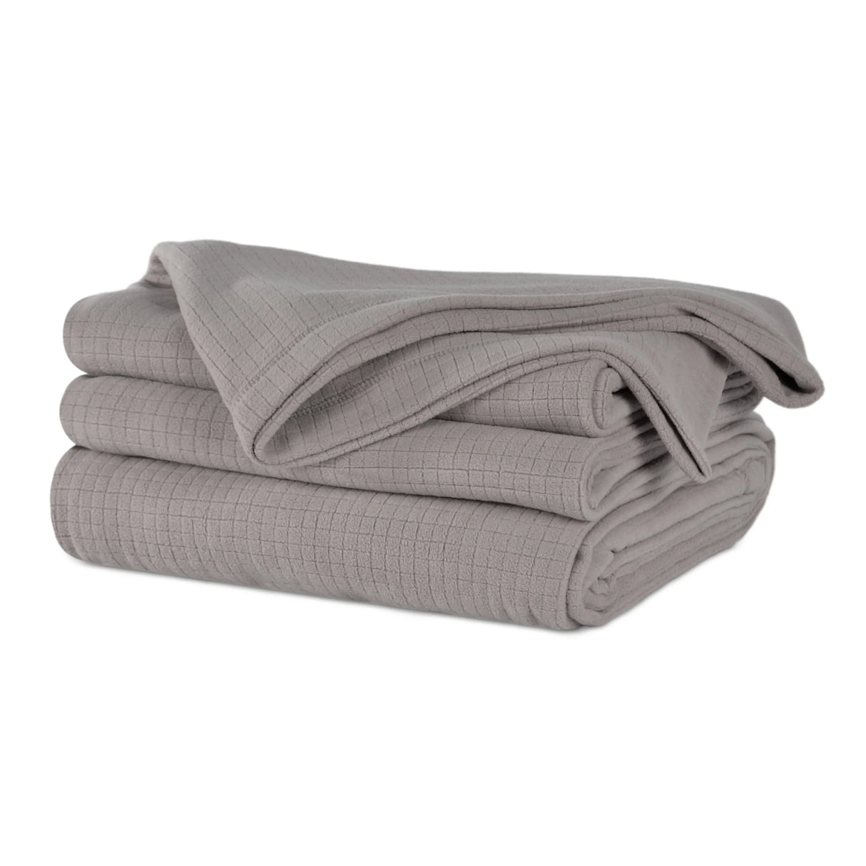 Grey colored fluffy and luxurious blanket neatly folded. Product shot.