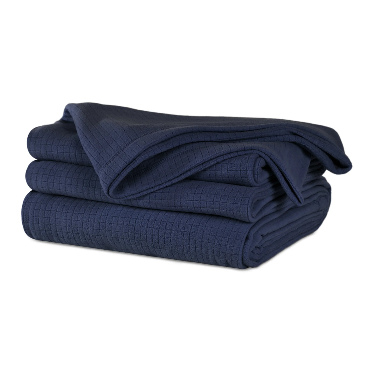 Midnight blue colored fluffy and luxurious blanket neatly folded. Product shot.