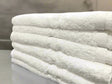 Product shot of healthcare towels in shade white, photo for wholesale supplier for healthcare, hotels and hospitality.