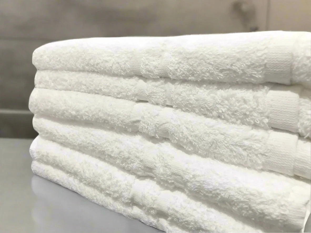 Product shot of healthcare towels in shade white, photo for wholesale supplier for healthcare, hotels and hospitality.
