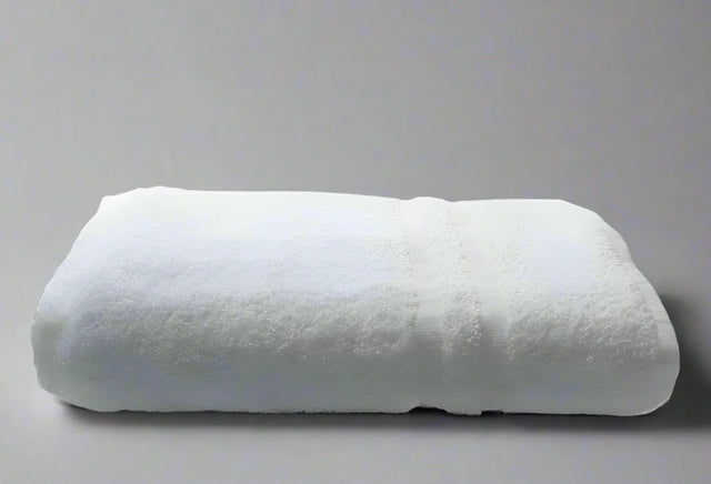 Product shot of healthcare towels in shade white, photo for wholesale supplier for healthcare, hotels and hospitality.