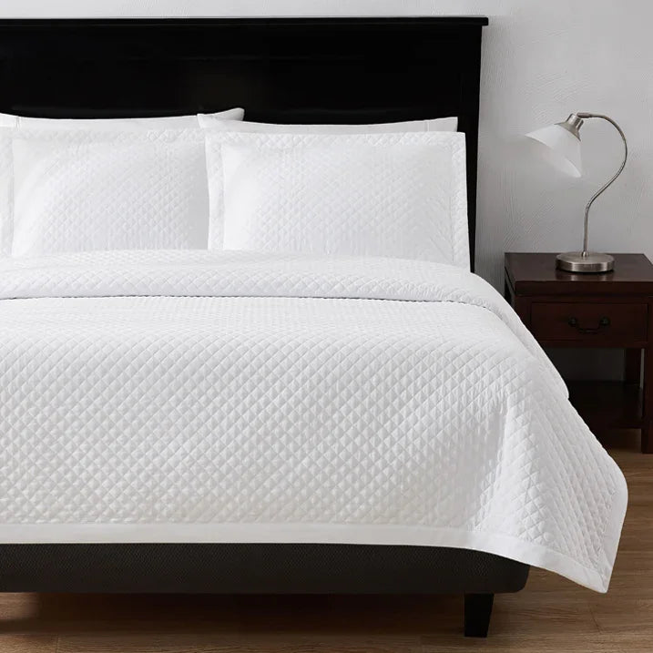 Diamond stitch bedding by Boston Textile Co. Stark white color for hotel wholesale.