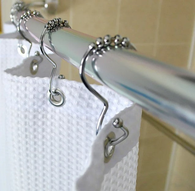 Chrome hook for easy shower curtain management. Roller ball for easy movement.
