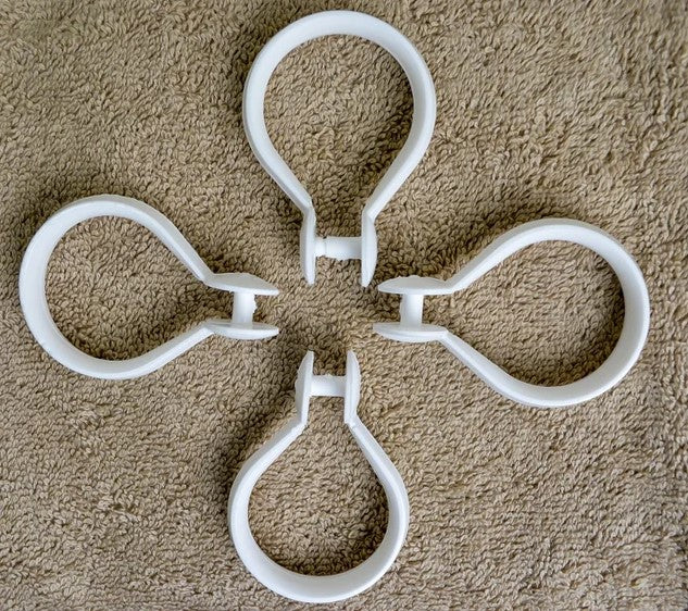 White shower hooks by Boston Textile Co.