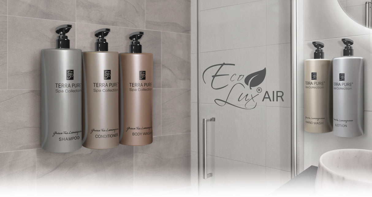 Terra Pure bracket system to hold dispenser size products. Image shows shampoo, conditioner, body wash, hand wash and lotion all displayed on a bathroom wall. The EcoLux Air logo is printed on the door.