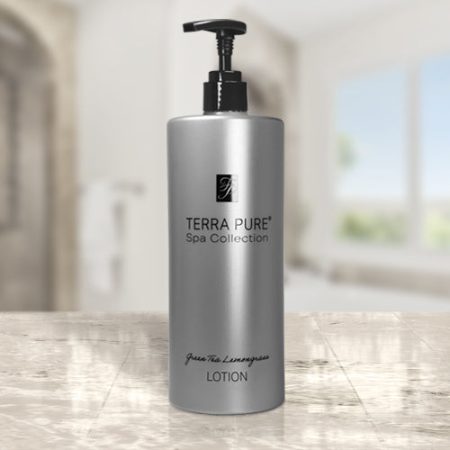 Terra Pure Luxury Hotel Amenities Collection body lotion. Product shot on marble countertop in a bright lit room.