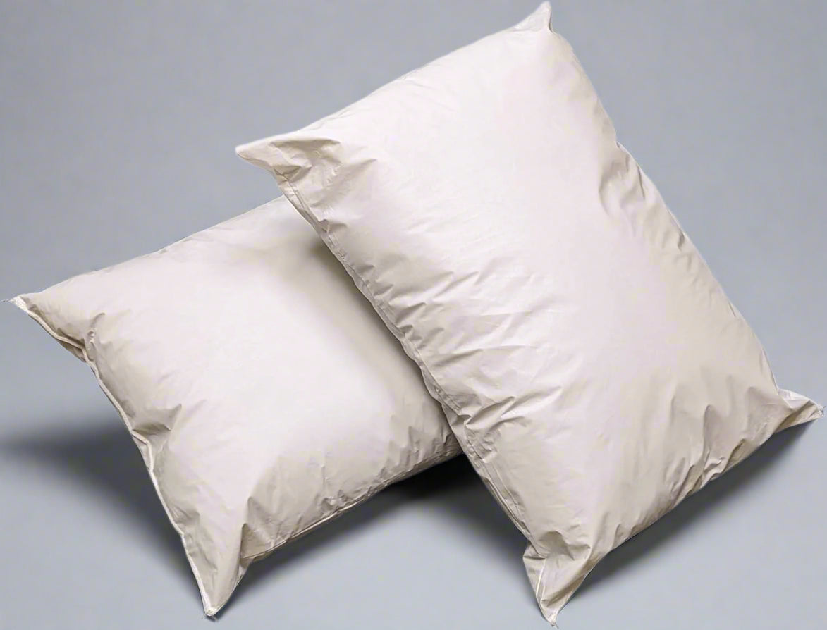 Product shot of two pillows stacked up against eachother wholesale supplier for hotels and hospitals