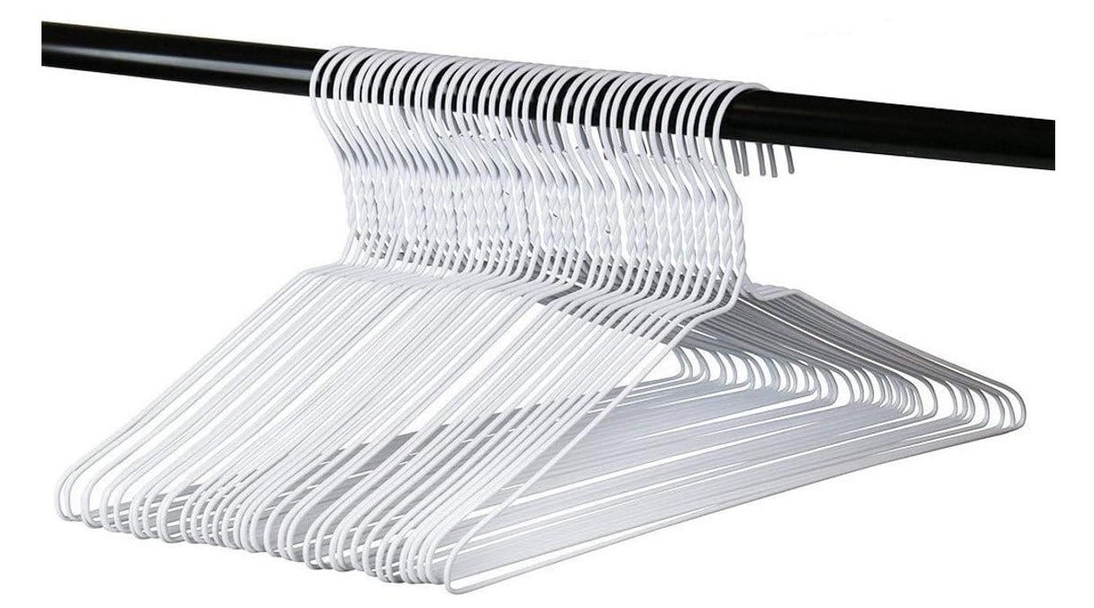Set of white hangers on a black rod against a white background
