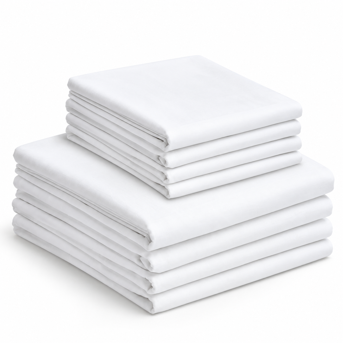 Pictured: Neatly folded white Economy Sheets stacked on top of each other. There are 4 larger sheets on the bottom and 4 smaller sheets stacked on top.