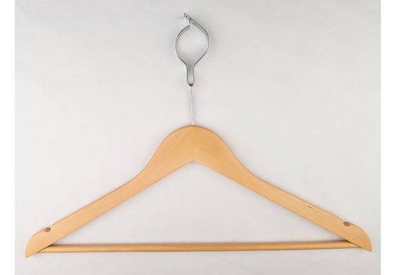 Wooden hanger with a metal hook on a white background