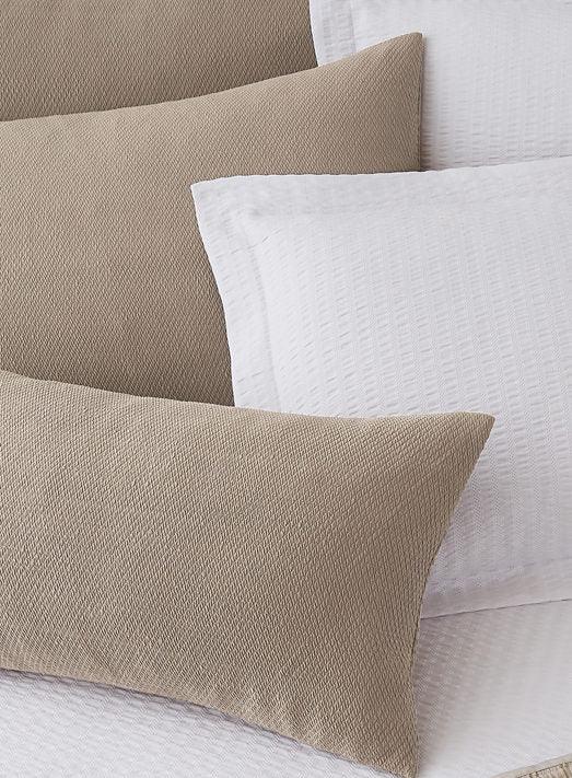 Decorative Pillows with soft texture in white and beige/khaki.