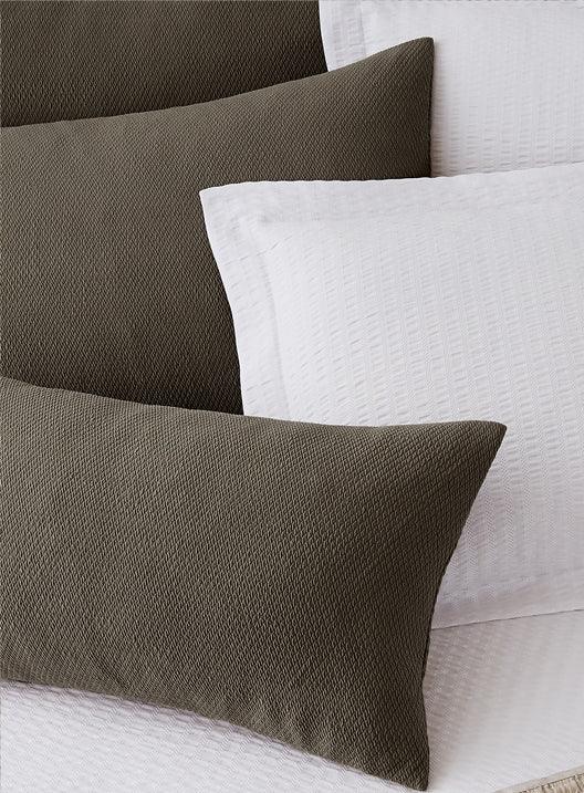 Decorative Pillows with soft texture in white and dark brown.