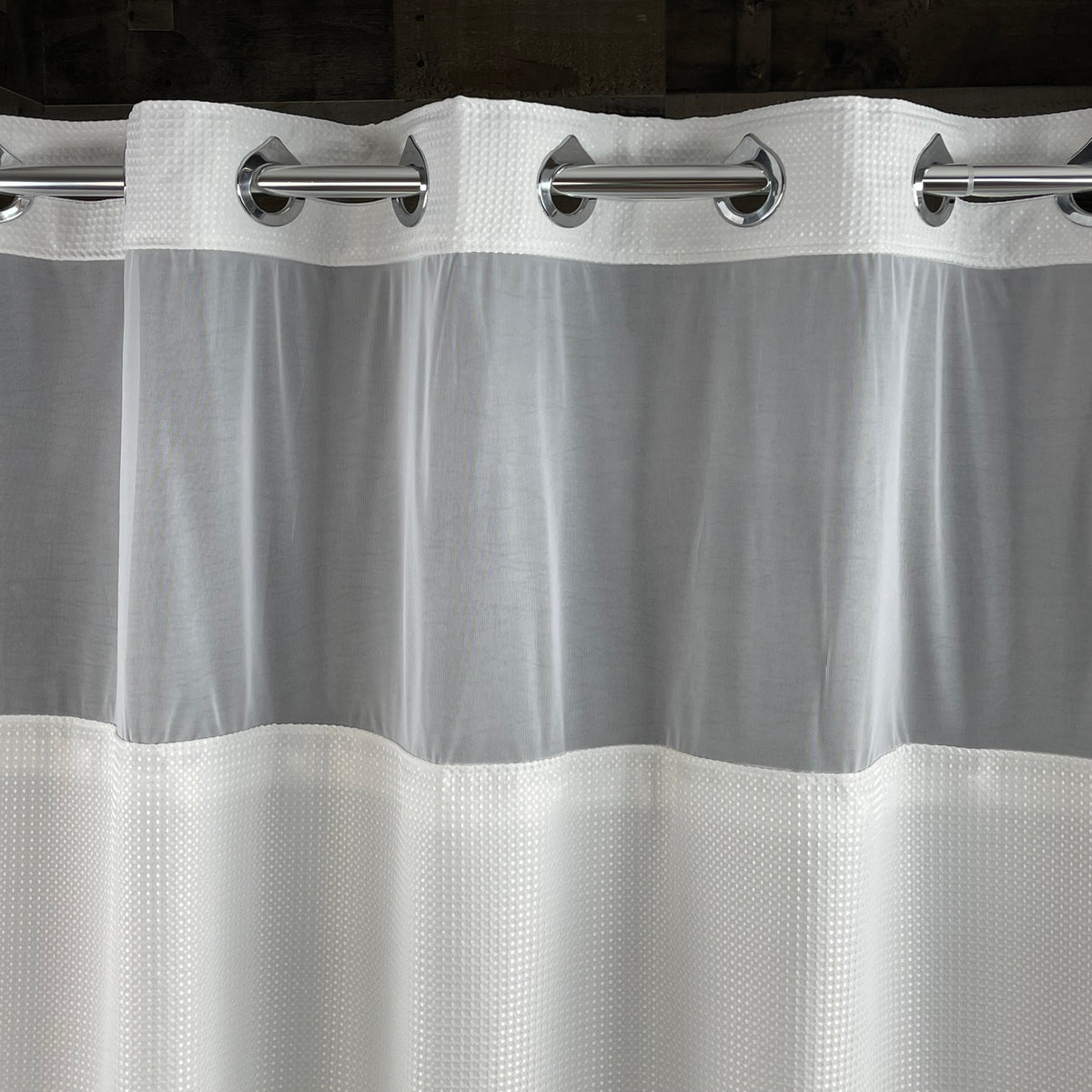 Pictured: Close-up of the white Hang2It Waffle Shower Curtain, giving a better view of the texture and the window section of the curtain.