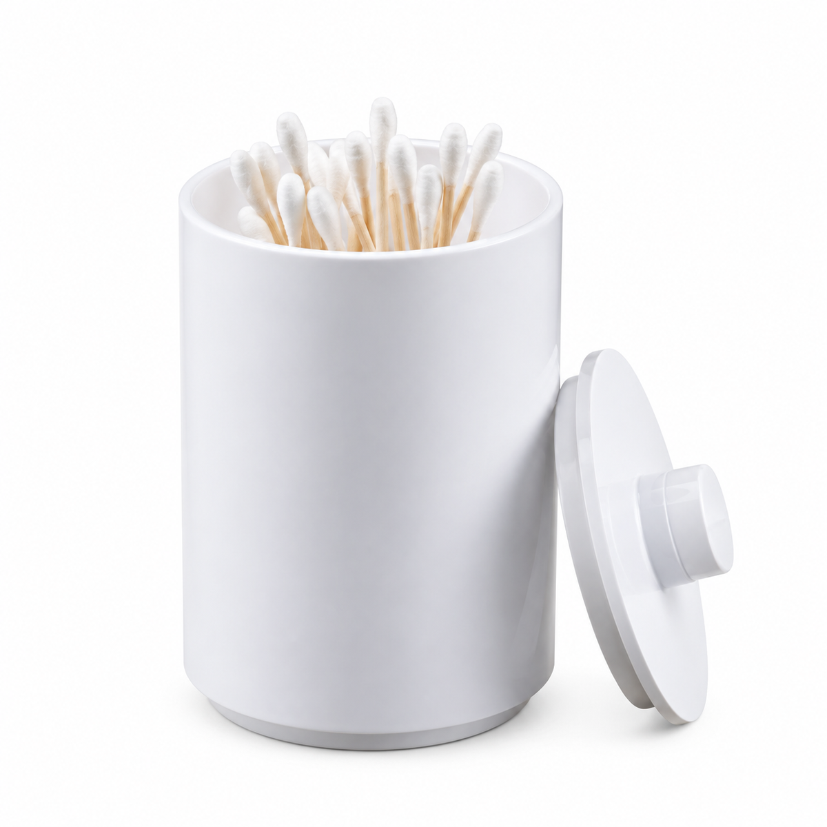 Pictured: White Oasis Apothecary jar holding multiple cotton swabs. The lid to the jar is leaning against the jar. Against a white background.