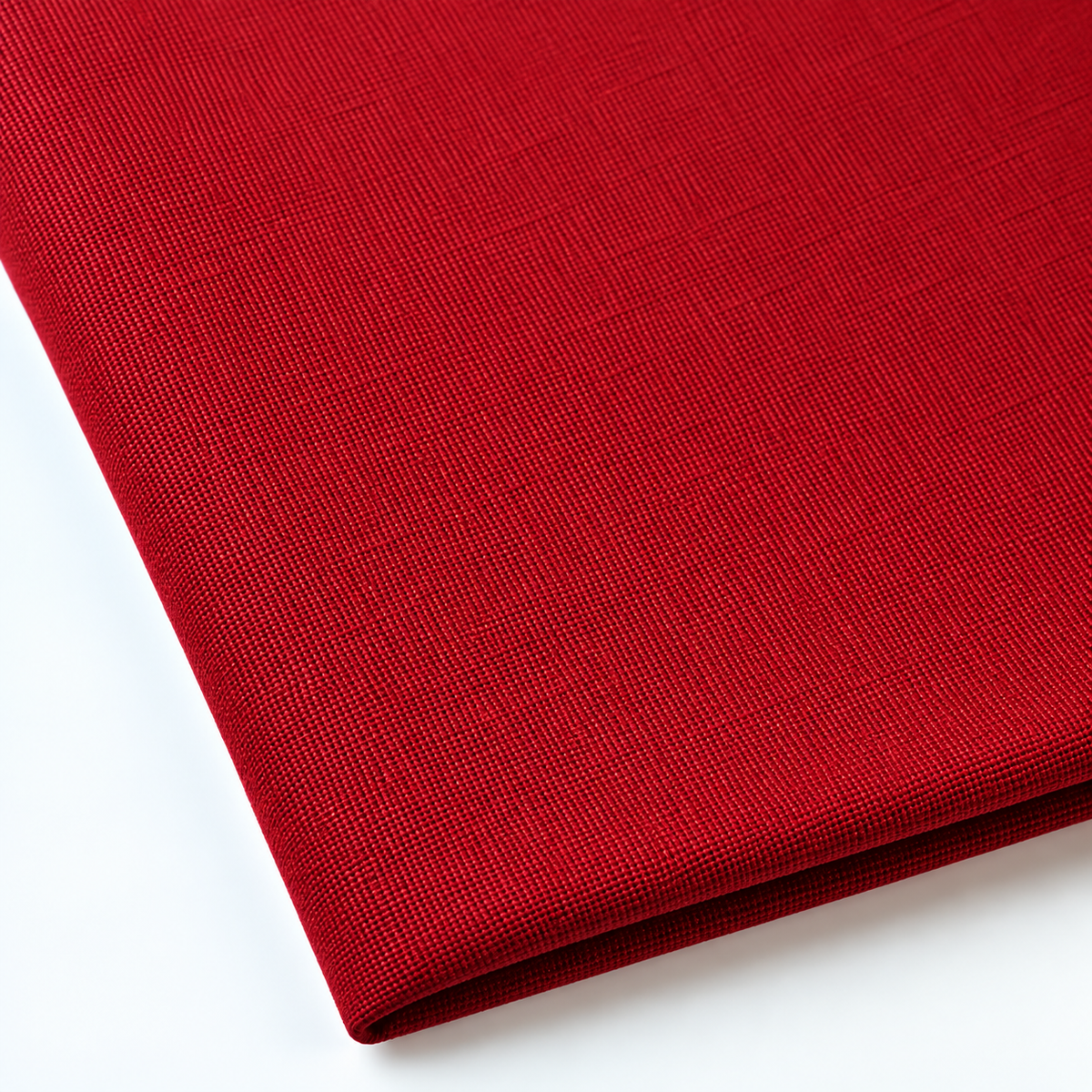 Pictured: Close up of the Premier Napkin neatly folded in the shade Flag Red against a white background.