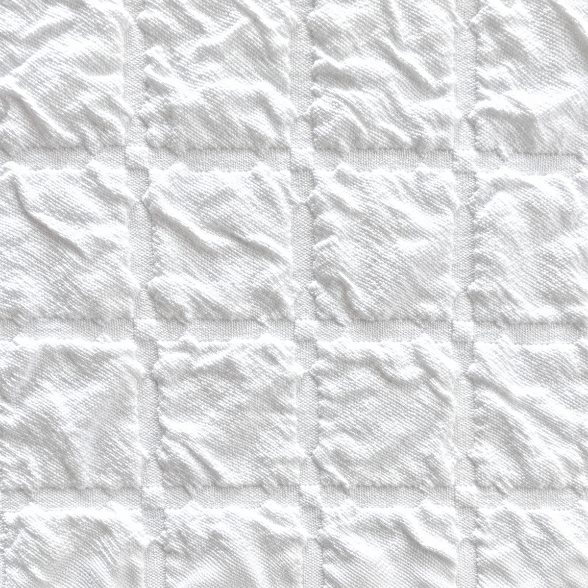 Pictured: Extreme closeup of the jacquard style top sheet. You can see the detail and the texture of the blanket here.
