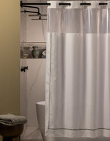 Hookless Shower Curtain in a Moody bathroom and marble walls