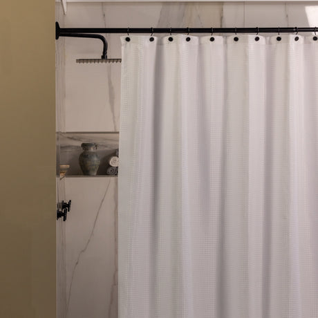 Shower curtain with a textured pattern in a bathroom setting