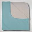 Pictured: A folded reusable underpad with a twill weave pattern on the top layer and a solid color on the bottom layer for absorbency against a white background.